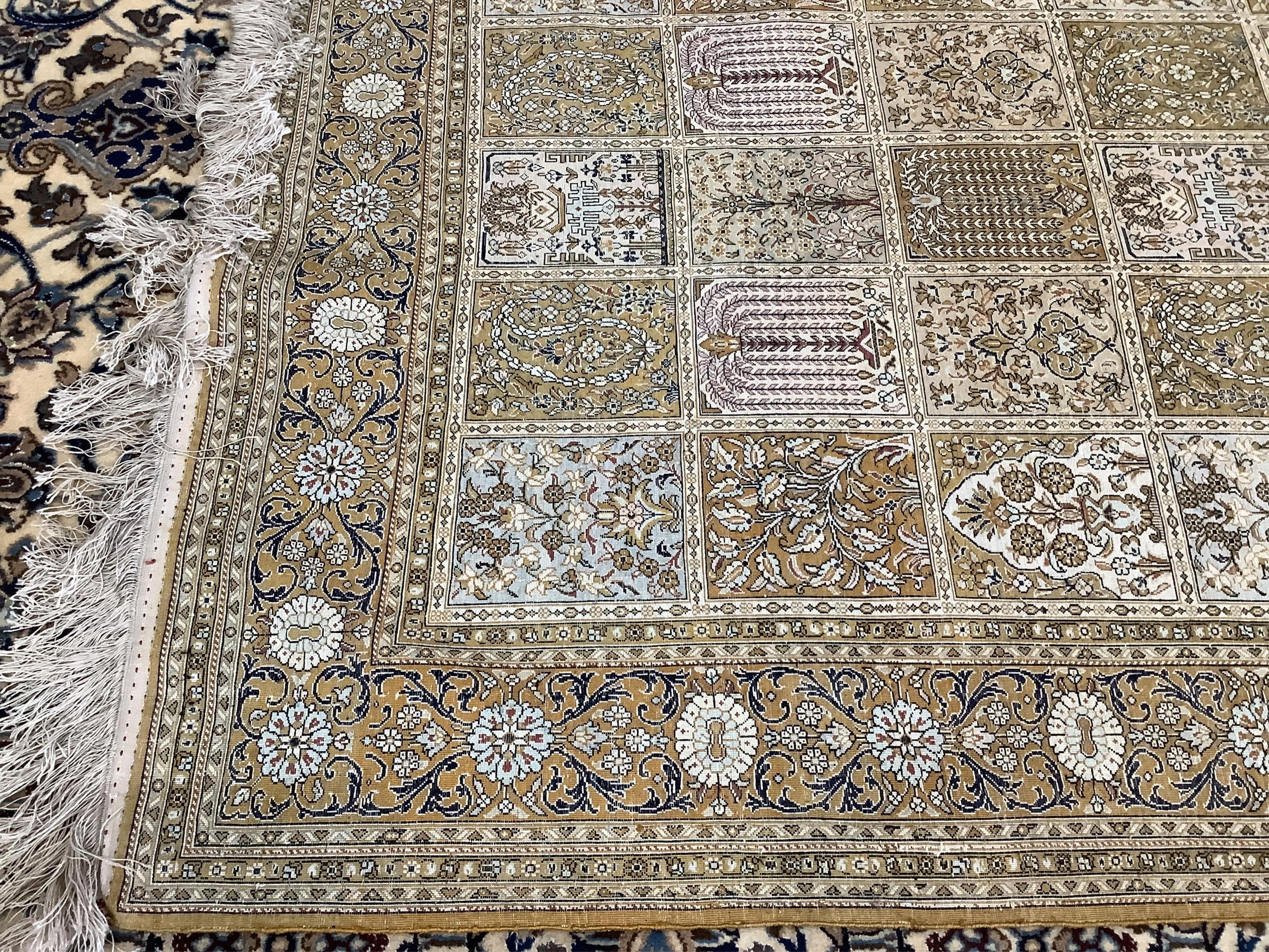 A Kashmir ‘silk’ rug, woven all over with rectangles filled with stylised flowers, 220 x 138cm